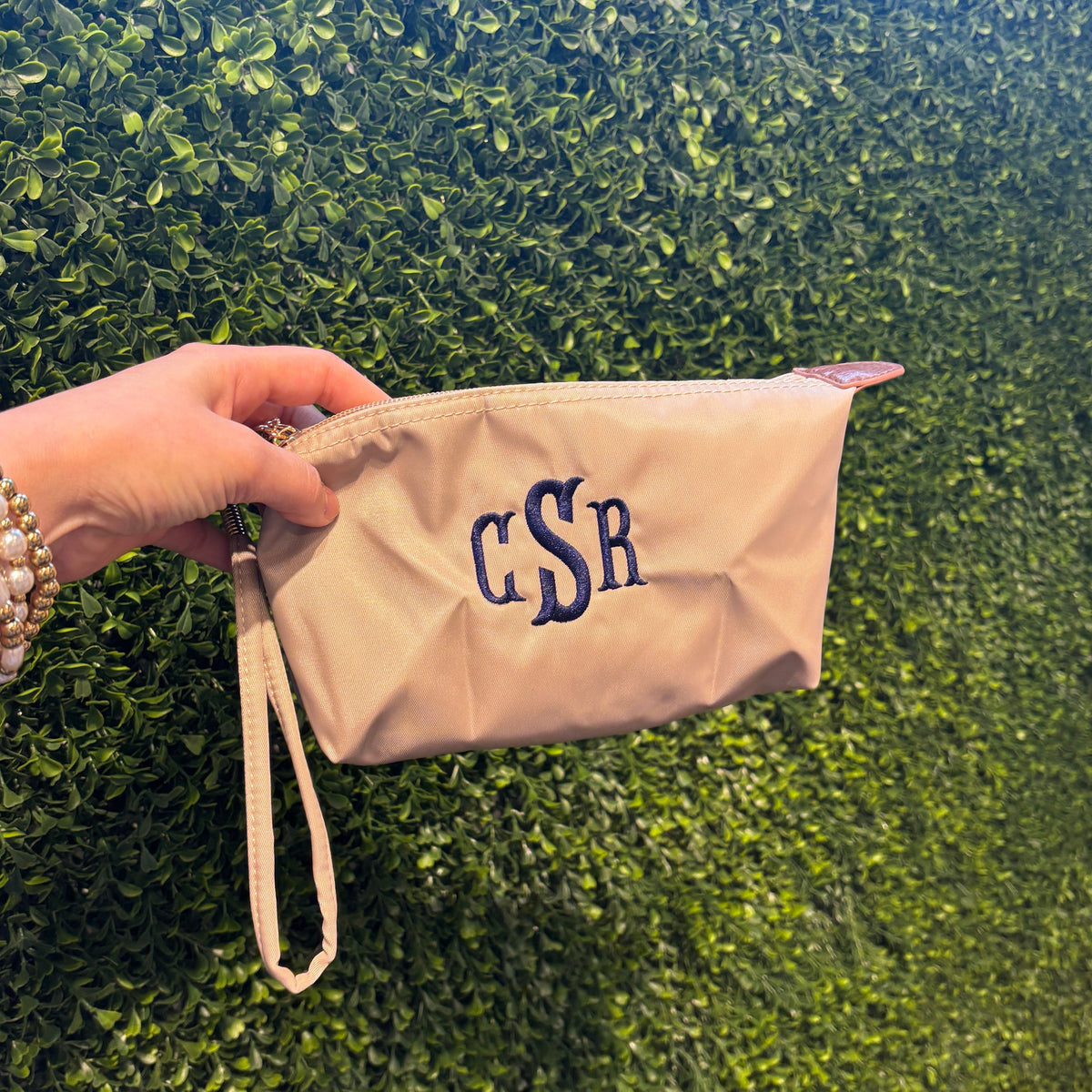 monogrammed beige pouch or cosmetic bag with wristlet strap with initials in navy thread